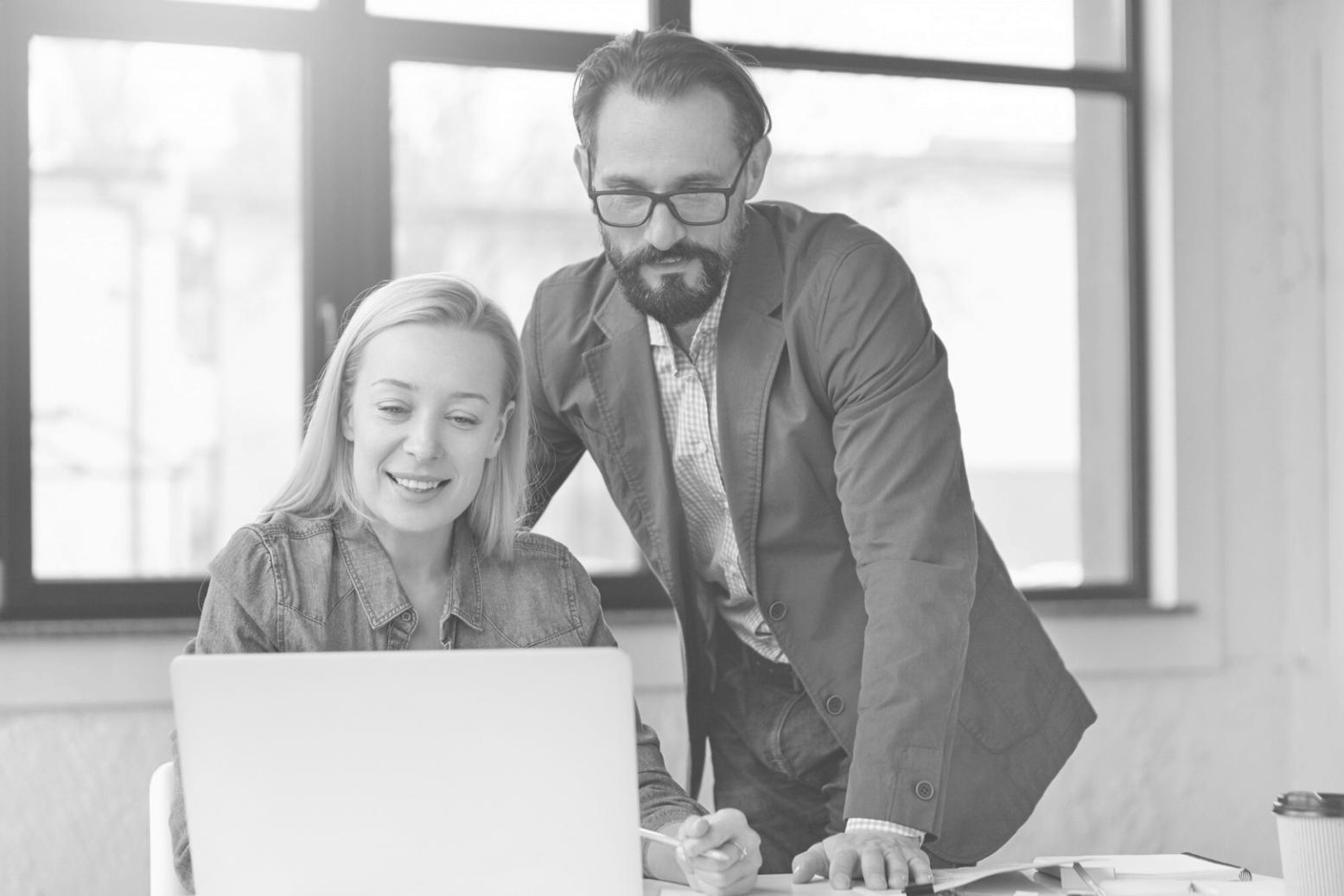 Financial planning tools and budget worksheets spread across desk workspace
