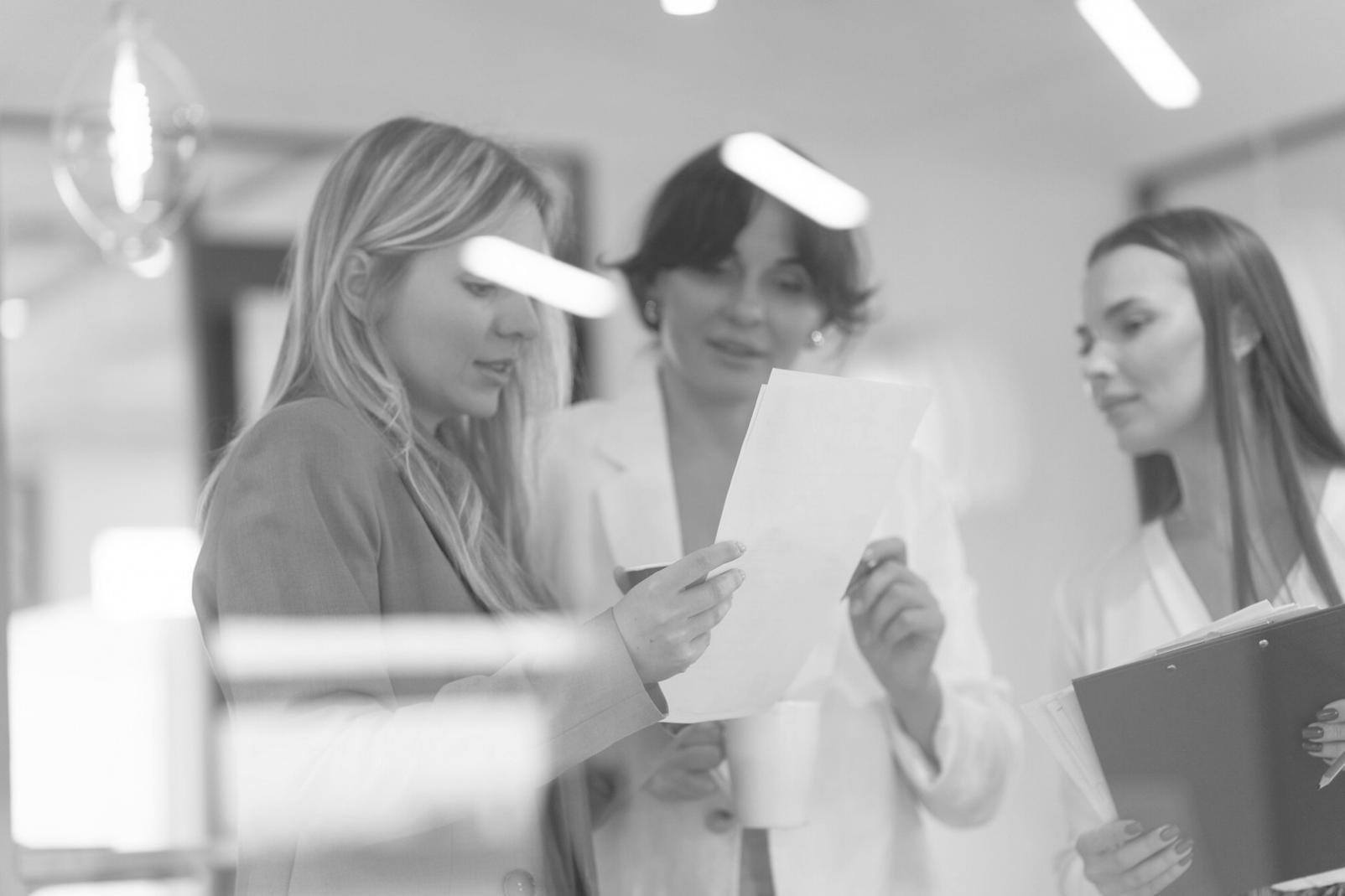 Person reviewing financial goals and budget planning documentation at organized workspace